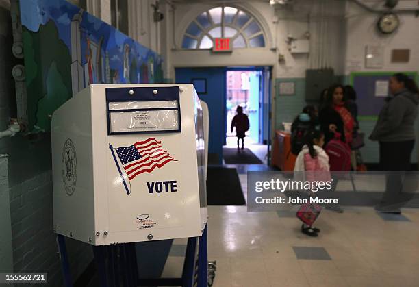 Voting booth stands at the ready as students return to school on November 5, 2012 in the East Village neighborhood of New York, United States....