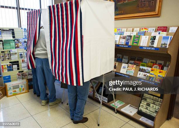 Citizens of New Jersey's Ocean County vote on November 5 at the Ocean County Administration building in Toms River in a special early mail voting...