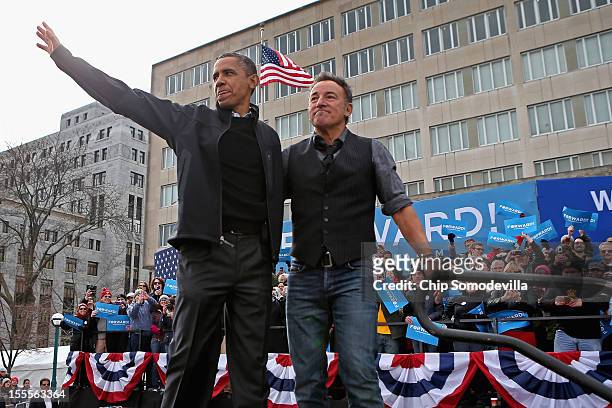 President Barack Obama and rocker Bruce Springsteen wave to a crowd of 18,000 people during a rally on the last day of campaigning in the general...