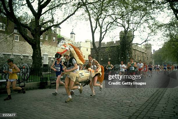 Pantomime horse runs past the Tower of London during the London Marathon. \ Mandatory Credit: Allsport UK /Allsport