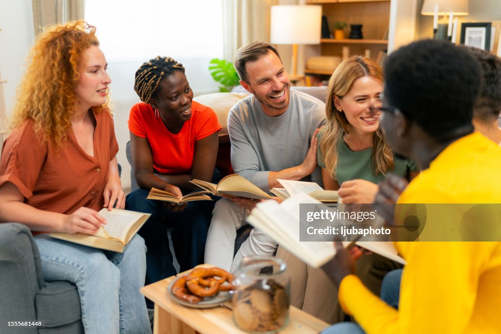 Bible group sitting in a circle reading a passage together