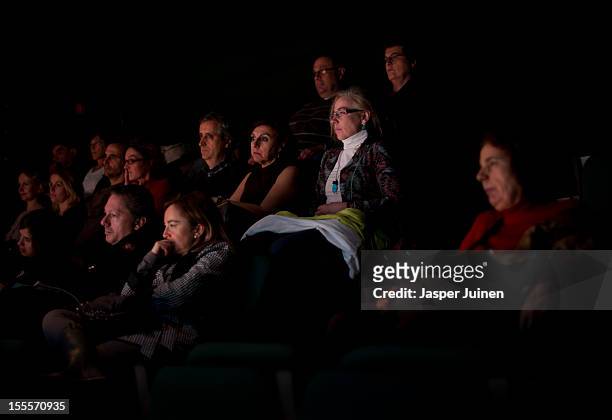 Spectators watch the actors play in the 'Tres Anos' theater show, a show that plays in the 1930's between the first and Second World War, at the...