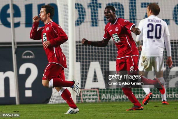 Alexander Baumjohann of Kaiserslautern celebrates his team's second goal with team mate Mohamadou Idrissou during the Second Bundesliga match between...