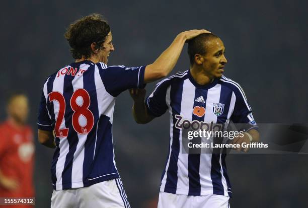 Peter Odemwingie of West Bromwich Albion is congratulated by team-mate Billy Jones after scoring the opening goal during the Barclays Premier League...