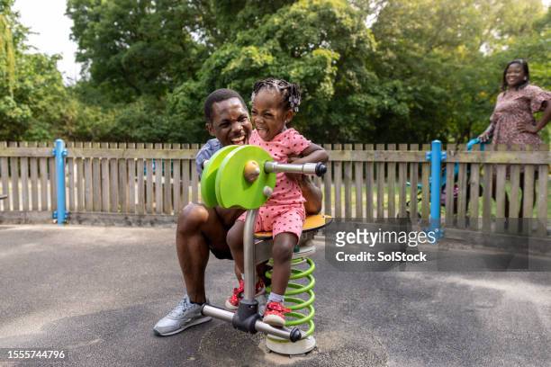 fun in the park - black children stock pictures, royalty-free photos & images