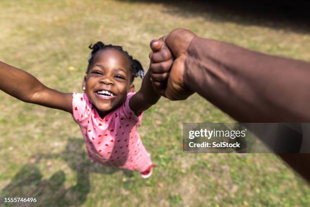 daddy and daughter connection - child and unusual angle stockfoto's en -beelden