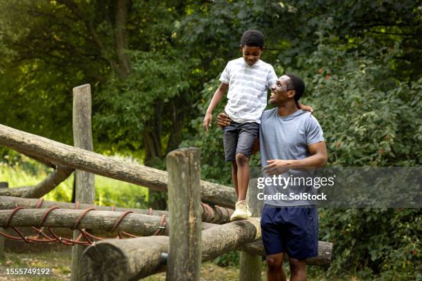 quality time with my son - playground equipment happy parent stock pictures, royalty-free photos & images