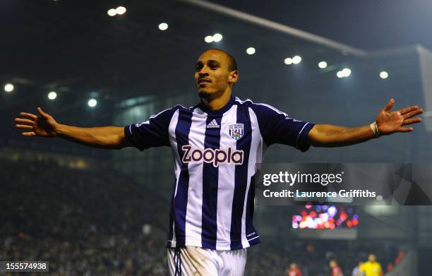 Peter Odemwingie of West Bromwich Albion celebrates scoring his team's second goal during the Barclays Premier League match between West Bromwich...