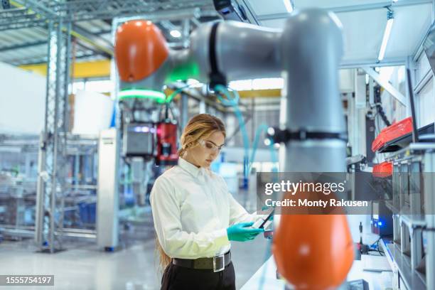 engineer with cobot in digital factory - industrial plant stock pictures, royalty-free photos & images