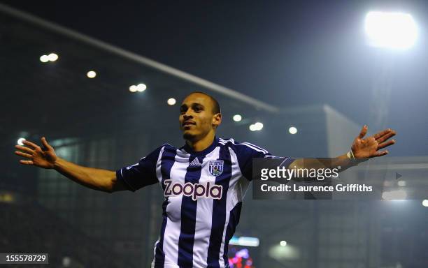 Peter Odemwingie of West Bromwich Albion celebrates scoring his team's second goal during the Barclays Premier League match between West Bromwich...