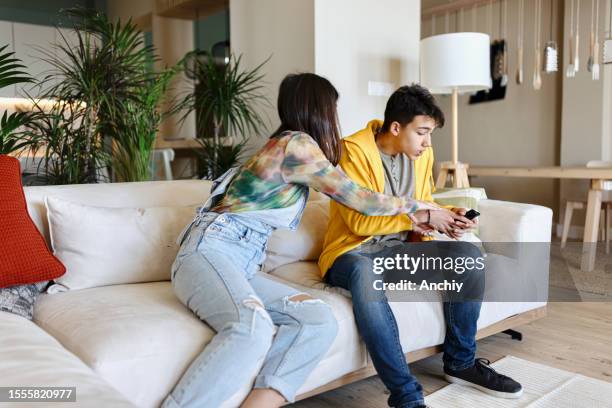 brother and sister fighting - annoying brother stock pictures, royalty-free photos & images