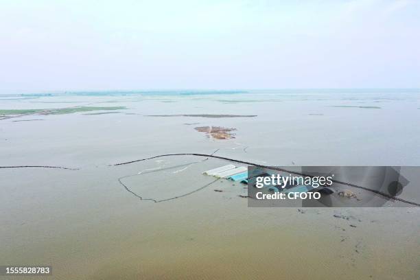 Drone aerial photo shows a flooded road in Zhenlai County in Baicheng City, Jilin Province, China, July 26, 2023. In recent days, the Baicheng area...