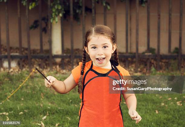happy little girl in halloween apron - råttsvans bildbanksfoton och bilder