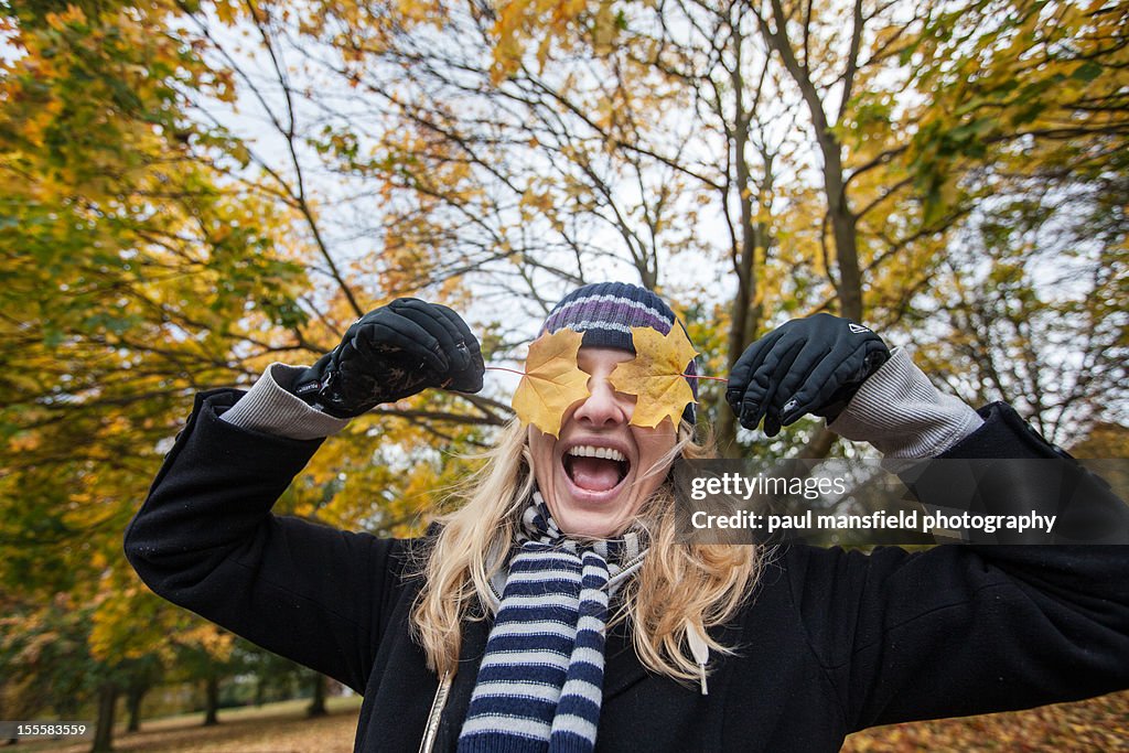 Lady posing with leaves as eyes