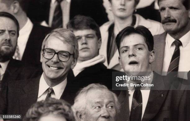 British Prime Minister John Major and his son James watching a football match between Norwich City and Manchester United at Carrow Road, Norwich,...