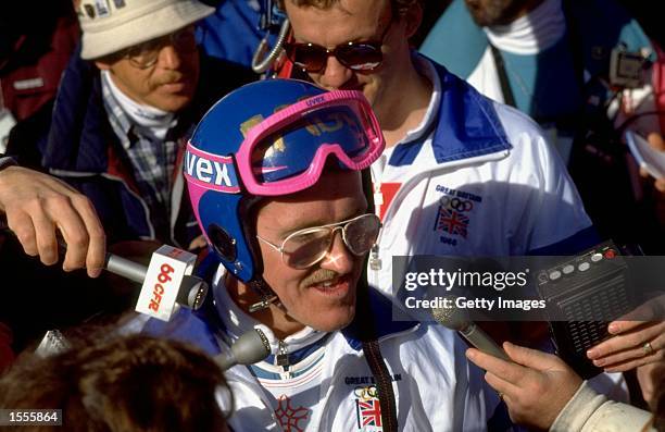 Eddie Edwards of Great Britain is surrounded by the press after the 90 metres Ski Jump event at the 1988 Winter Olympic Games in Calgary, Canada....