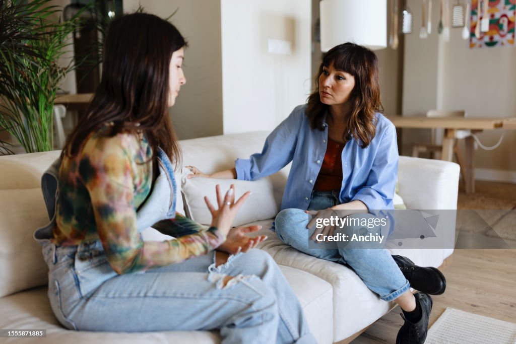 Mother and daughter talking at home