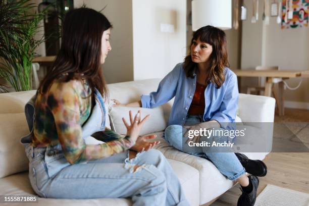 mother and daughter talking at home - girls arguing stock pictures, royalty-free photos & images