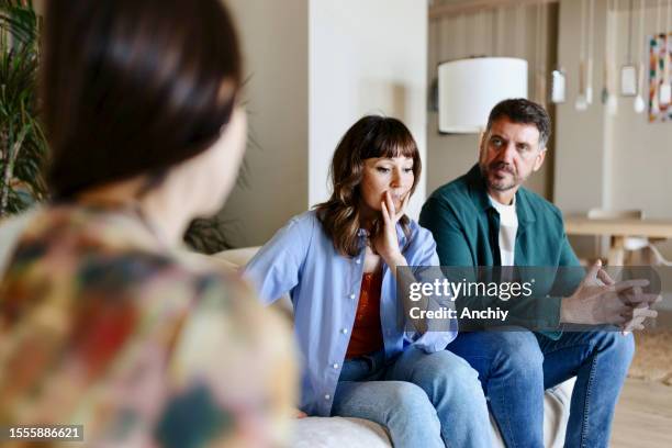 teenage girl talking with her parents - father and grown up daughter stock pictures, royalty-free photos & images