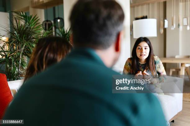 worried girl talking with her family - disappointed dad stock pictures, royalty-free photos & images