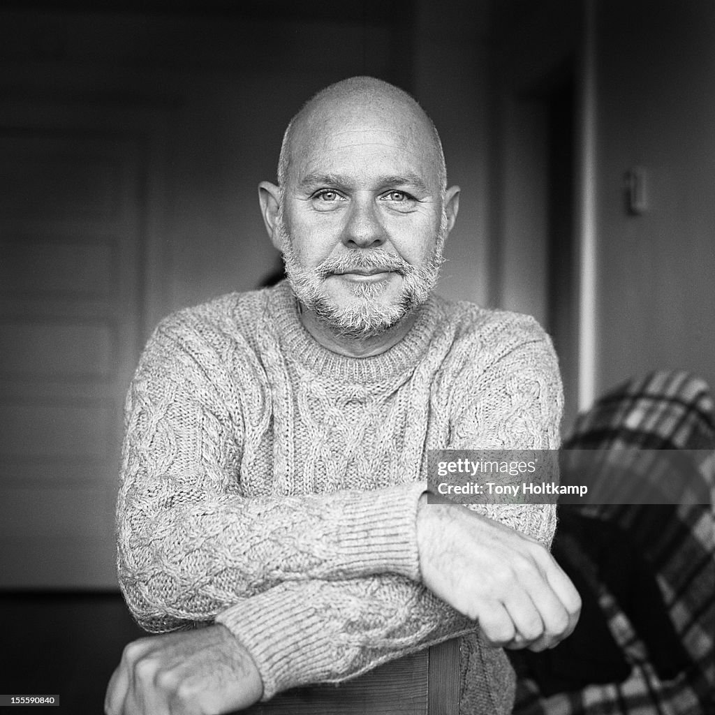Man with salt and pepper beard in black and white