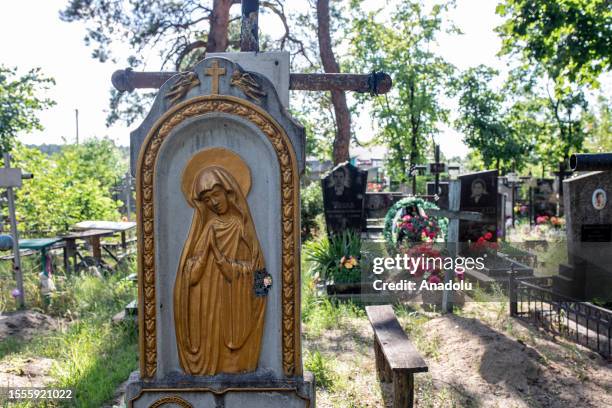 Tombstone is seen a cemetery amid Russia and Ukraine war in Moshchun village of Kyiv, Ukraine on July 25, 2023. Residents of Kyiv Oblast are still...