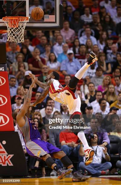 Udonis Haslem of the Miami Heat is fouled by P.J. Tucker of the Phoenix Suns during a game at AmericanAirlines Arena on November 5, 2012 in Miami,...