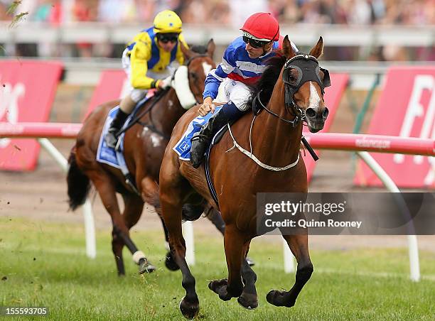 Hugh Bowman riding Koonoomoo crosses the line to win the Herald Sun Stakes during 2012 Melbourne Cup Day at Flemington Racecourse on November 6, 2012...