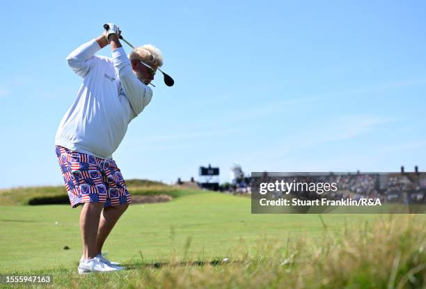 John Daly of the United States plays a shot whilst smoking a cigarette during a practice round prior to The 151st Open at Royal Liverpool Golf Club...