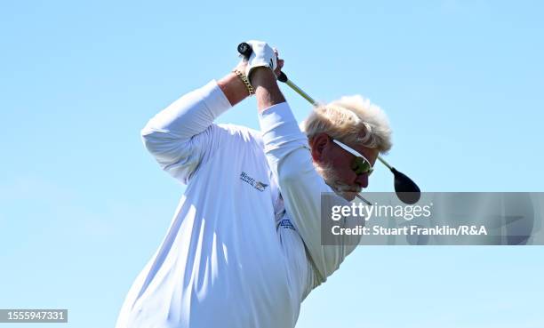 John Daly of the United States plays a shot whilst smoking a cigarette during a practice round prior to The 151st Open at Royal Liverpool Golf Club...
