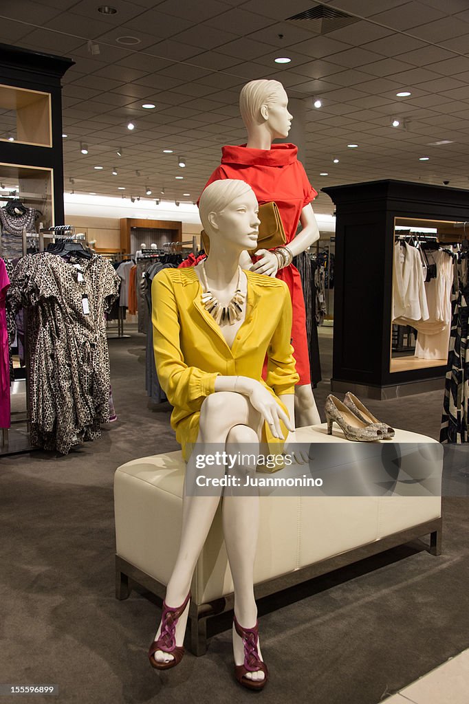 Two Fashion Mannequins Dressed Up In A Clothing Store High-Res