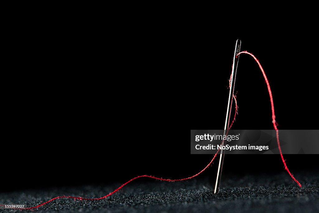Needle and red thread