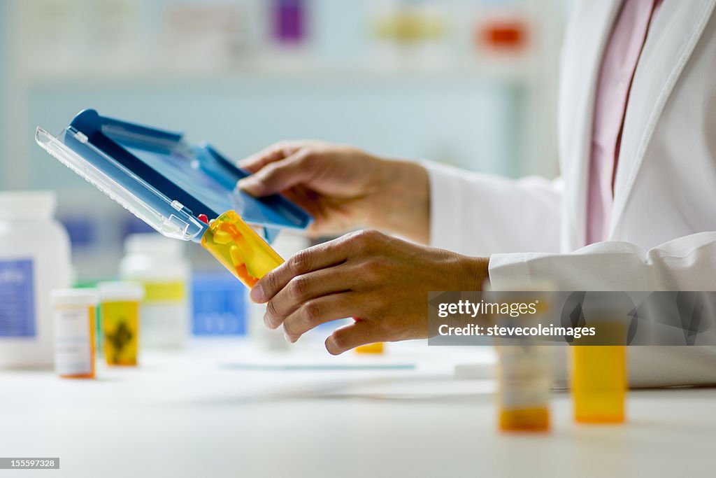 Pharmacy Hands with Pill Counter Tray and Bottle