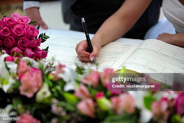 wedding: signing the register - marriage certificate stock pictures, royalty-free photos & images