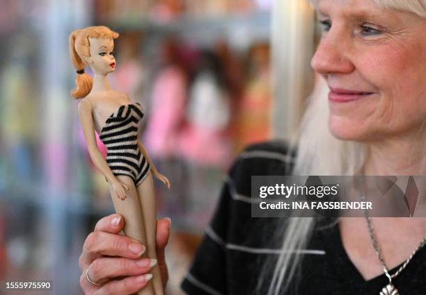 Barbie collector Bettina Dorfmann holds one of the first Barbies, which was presented at a toy fair in the USA in 1959, at her "Barbie clinic" in...