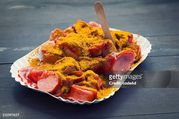germany currywurst - a sausage with curry sauce - curry powder stock pictures, royalty-free photos & images
