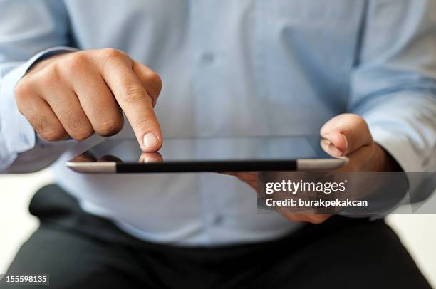 close up of businessman using digital tablet - tv phone tablet stock pictures, royalty-free photos & images