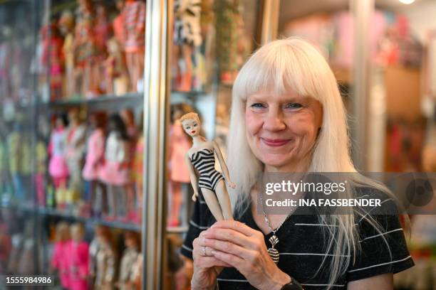 Barbie collector Bettina Dorfmann holds one of the first Barbies, which was presented at a toy fair in the USA in 1959, at her "Barbie clinic" in...
