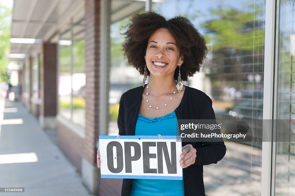 Woman with Open Sign