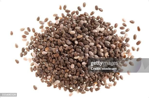 pile of chia seeds on white - chia seed stock pictures, royalty-free photos & images