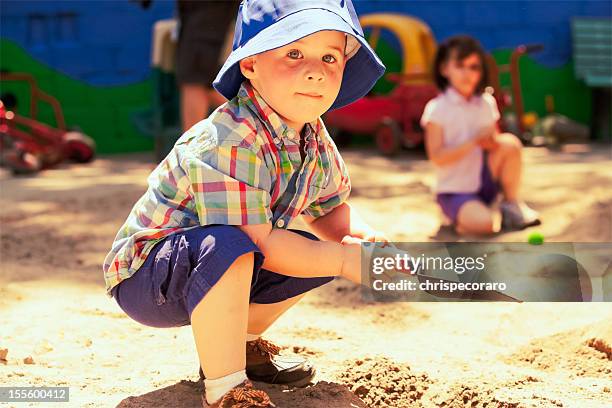 happy boy in the sandbox - 2 girls 1 sandbox stock pictures, royalty-free photos & images