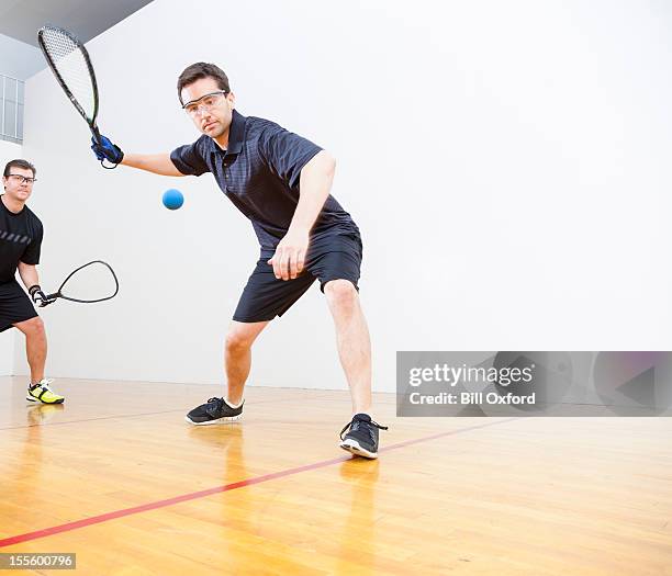 men playing racquetball - squash sport stockfoto's en -beelden