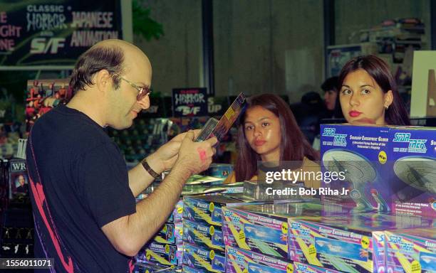 Star Trek fans look at themed merchandise at Star Trek Convention, March 19, 1994 in Pasadena, California.