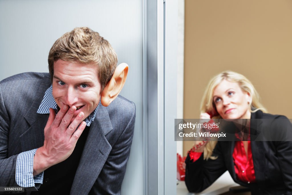 Man Eavesdropping Outside Office
