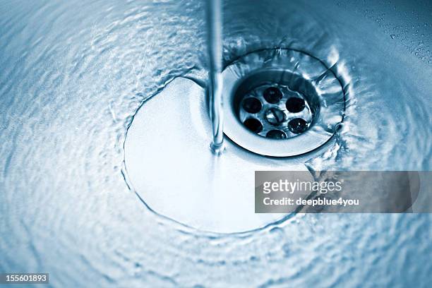 drain with water - sink plug stock pictures, royalty-free photos & images