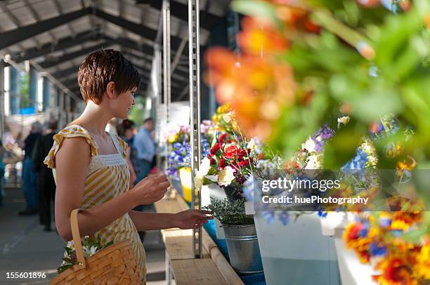 woman at farmers market with flowers - grand rapids michigan bildbanksfoton och bilder