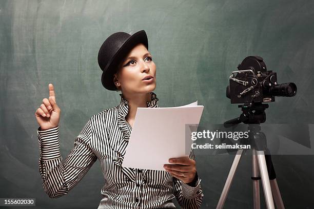 portrait of actress reading script behind camera - actor script stock pictures, royalty-free photos & images