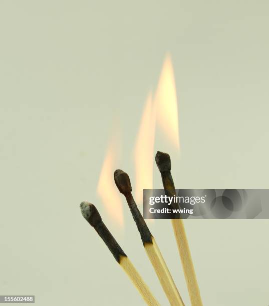 flaming matches ... light background - burnt matchstick stock pictures, royalty-free photos & images