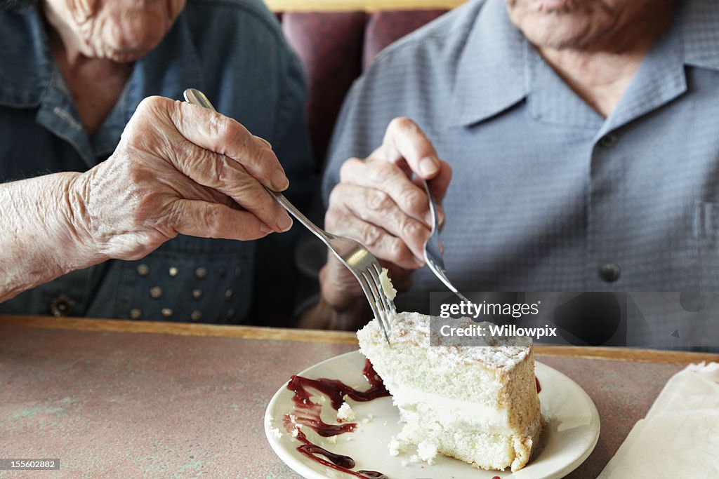 Grandpa and Grandma Sharing Cake