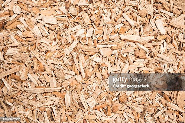 wood chip fuel for biomass boiler - wood chip texture stock pictures, royalty-free photos & images